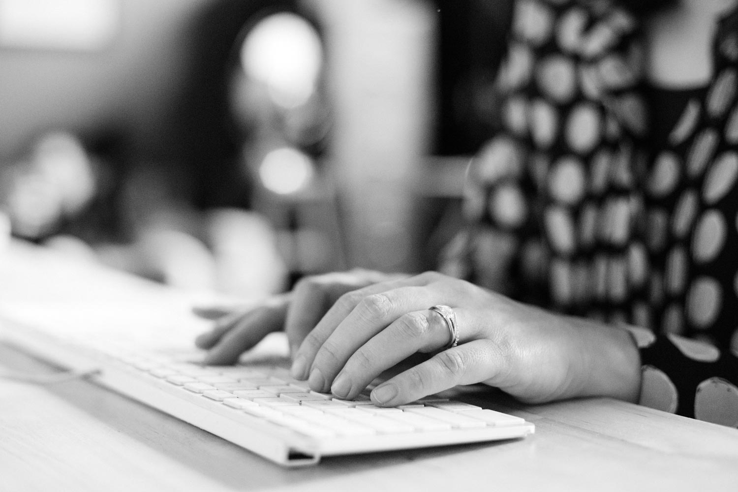 Person typing on keyboard signing up for church website hosting