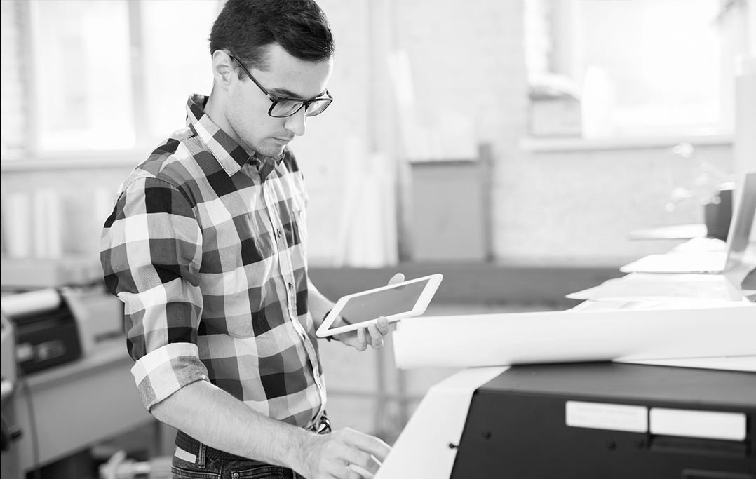 Man using tablet for online faxing